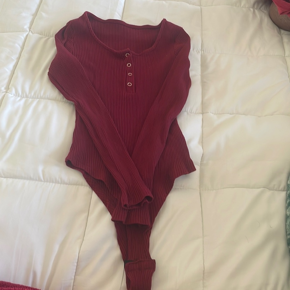 Elegant burgundy bodysuit never been worn. Just been hanging in my closet
